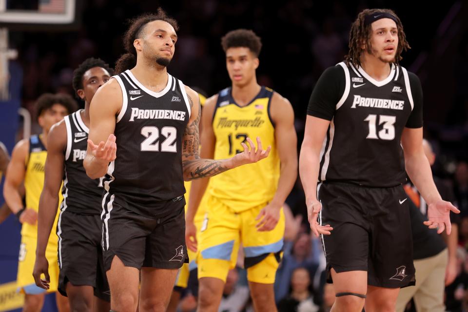 Providence guard Devin Carter (22) and forward Josh Oduro (13) react to a foul call during Friday's game against the Marquette Golden Eagles at Madison Square Garden. The Friars were among several Big East teams left out of the NCAA Tournament.