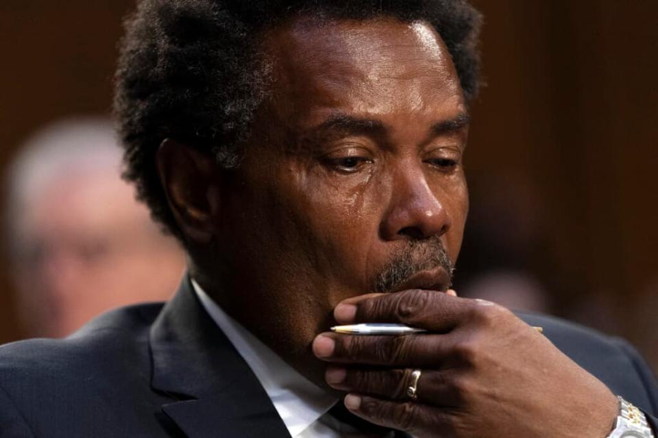 Garnell Whitfield Jr., of Buffalo, N.Y., whose mother, Ruth Whitfield, was killed in the Tops supermarket mass shooting, wipes away tears as he testifies at a Senate Judiciary Committee hearing on domestic terrorism Tuesday on Capitol Hill in Washington, D.C. (Photo: Jacquelyn Martin/AP)