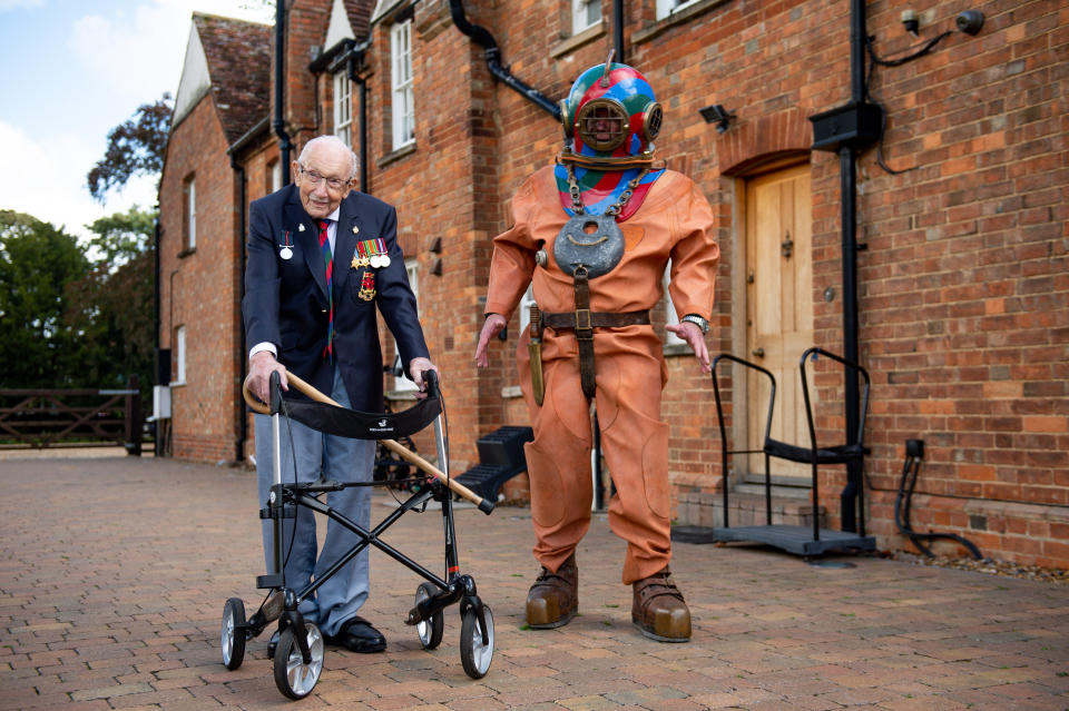 EMBARGOED TO 0001 FRIDAY SEPTEMBER 25 Captain Sir Tom Moore in Marston Moretaine, Bedford with veteran fundraiser Lloyd Scott, who will attempt to climb the Three Peaks whilst wearing a deep sea diving suit.