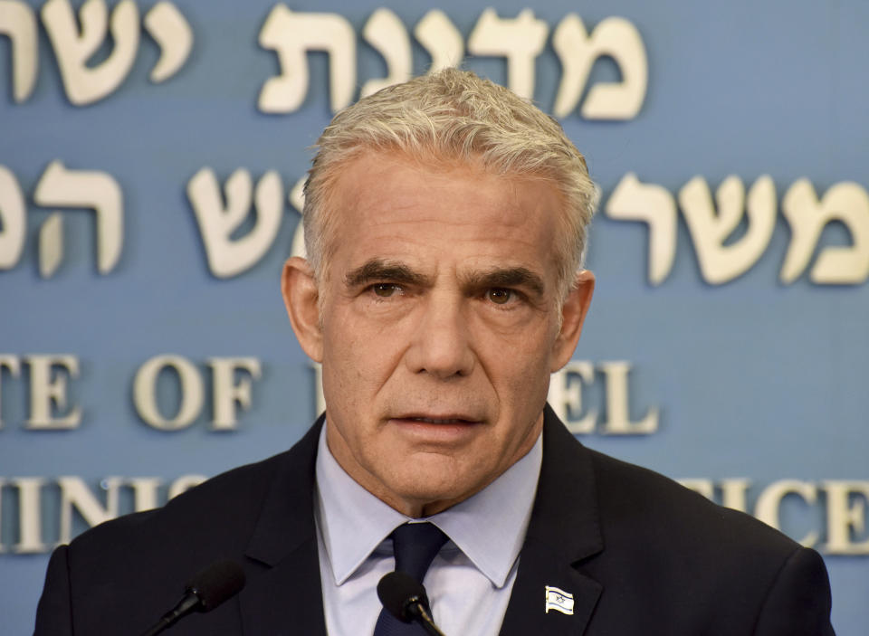 Israeli Prime Minister Yair Lapid speaks about Iran at a security briefing for the foreign press at the Prime Minister's office in Jerusalem, Wednesday, Aug. 24, 2022. Lapid called on U.S. President Joe Biden and Western powers to call off an emerging nuclear deal with Iran, saying an agreement would fail to prevent Iran from developing a nuclear bomb and reward it with billions of dollars to fund Israel's enemies. Israel's caretaker prime minister used stark language on Wednesday in his criticism of the expected agreement. (Debbie Hill/Pool via AP)