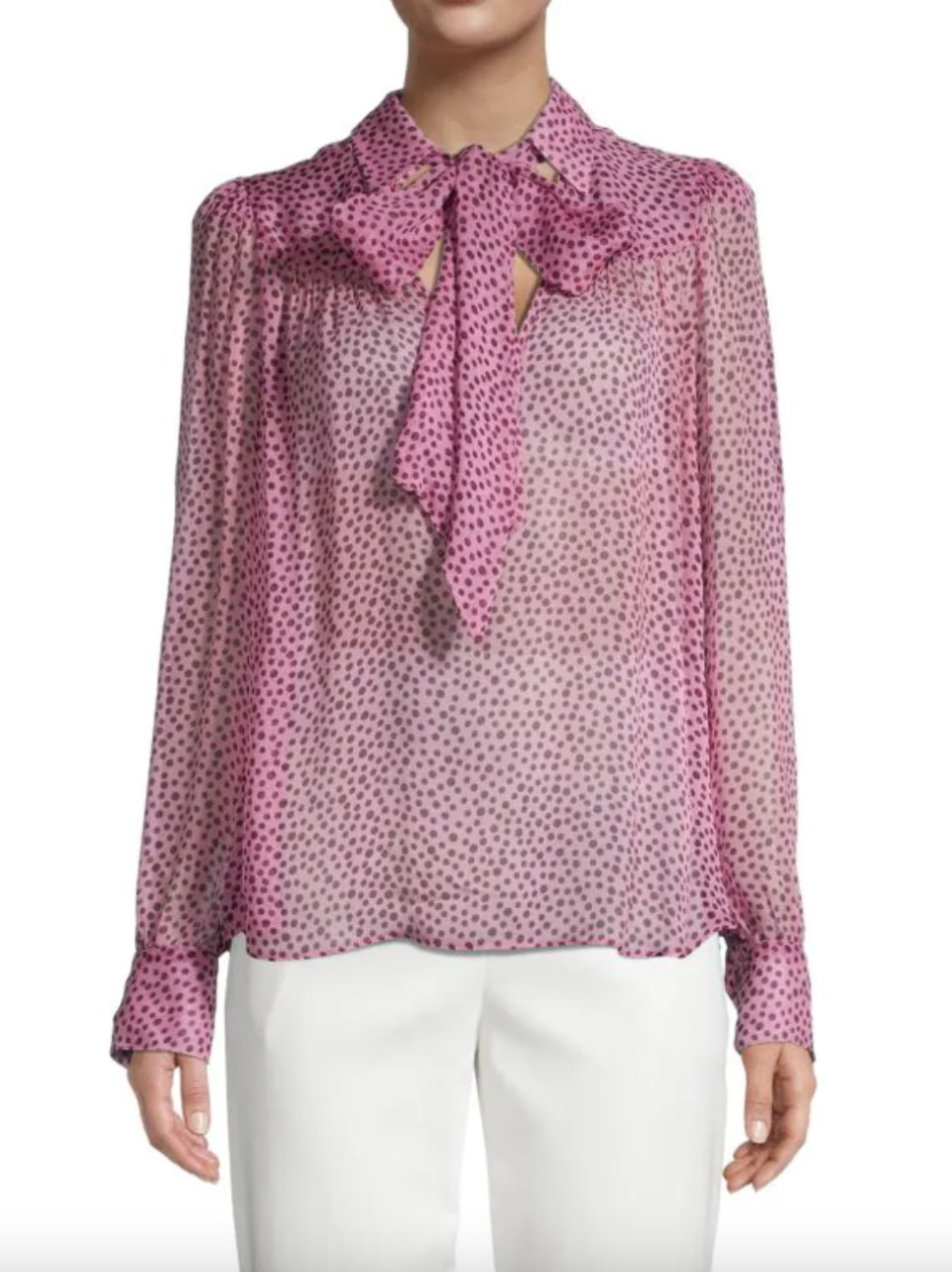 model in white pants and pink polka dot ​Teagan Dotted Bow Blouse (Photo via Saks Off Fifth)