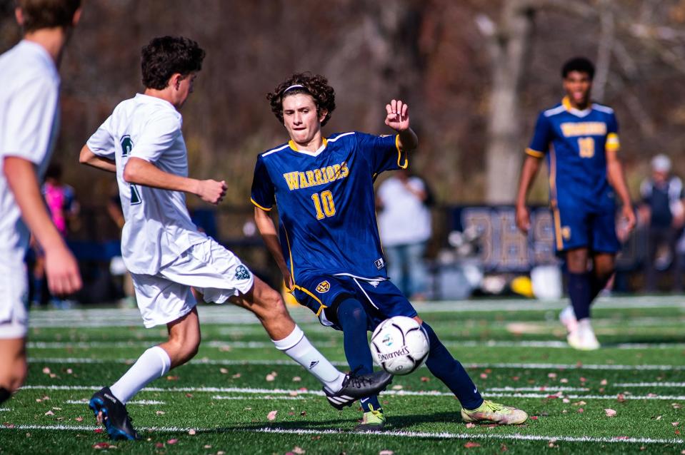 Lourdes' Evan Cancro slides in to defend during the boys class C regional soccer game in Beacon, NY on Saturday, November 5, 2022. Lourdes defeated Carle Place. KELLY MARSH/FOR THE POUGHKEEPSIE JOURNAL 