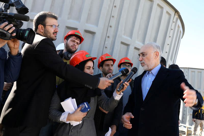 Head of Iran's Atomic Energy Organization Salehi speaks with media during his visit to the nuclear water reactor at Arak