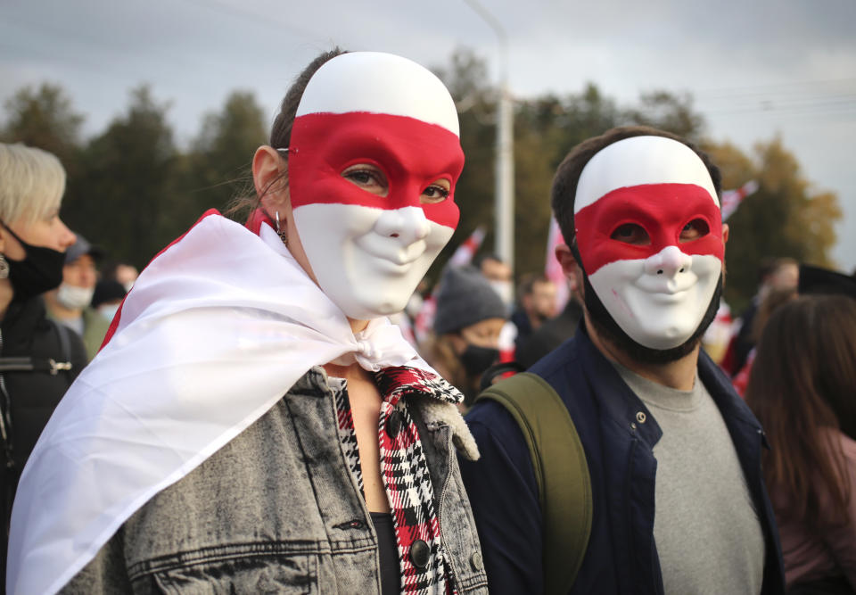 People attend an opposition rally to protest the official presidential election results in Minsk, Belarus, Sunday, Oct. 25, 2020. The demonstrations were triggered by official results giving President Alexander Lukashenko 80% of the vote in the Aug. 9 election that the opposition insists was rigged. Lukashenko, who has ruled Belarus with an iron fist since 1994, has accused the United States and its allies of fomenting unrest in the ex-Soviet country. (AP Photo)