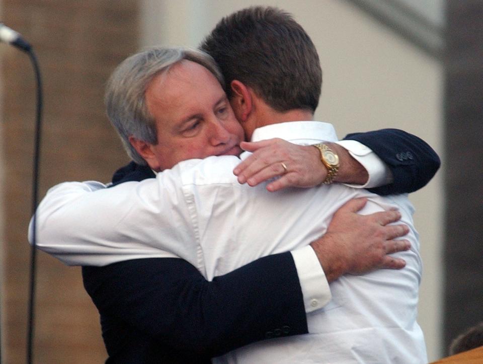Sarasota County Sheriff William Balkwill hugs Steven Kansler, the step-father of Carlie J. Brucia, during a memorial service Tuesday, Feb. 10, 2004 at the Central Church of Christ in Sarasota, Fla. (AP Photo/Steve Nesius)