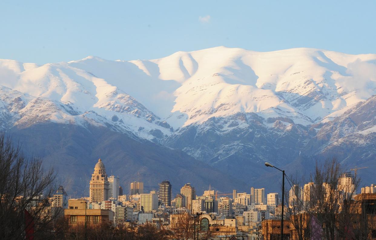 Iran's capital Tehran sits in the shadow of the Alborz mountains - 2016 Scott Peterson