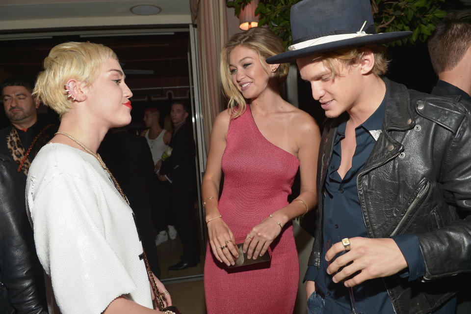 A photo of Miley Cyrus, Gigi Hadid and Cody Simpson at The DAILY FRONT ROW "Fashion Los Angeles Awards" Show at Sunset Tower on January 22, 2015 in West Hollywood, California.