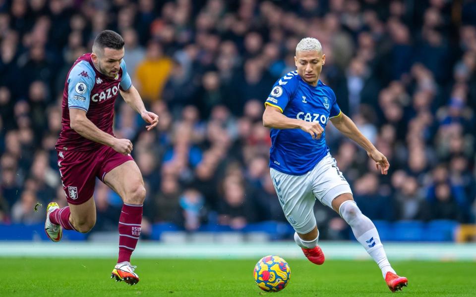 Richarlison of Everton on the ball with John McGinn of Aston Villa during the Premier League match between Everton and Aston Villa at Goodison Park on January 22, 2022 in Liverpool, England - Everton FC/Everton FC via Getty Images