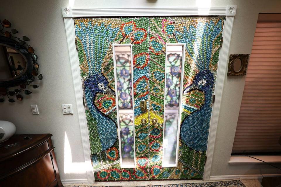 Mosaics of peacocks accent the front door of the San Luis Obispo home owned by Bruce and Suki Mason, seen here on May 10, 2024.