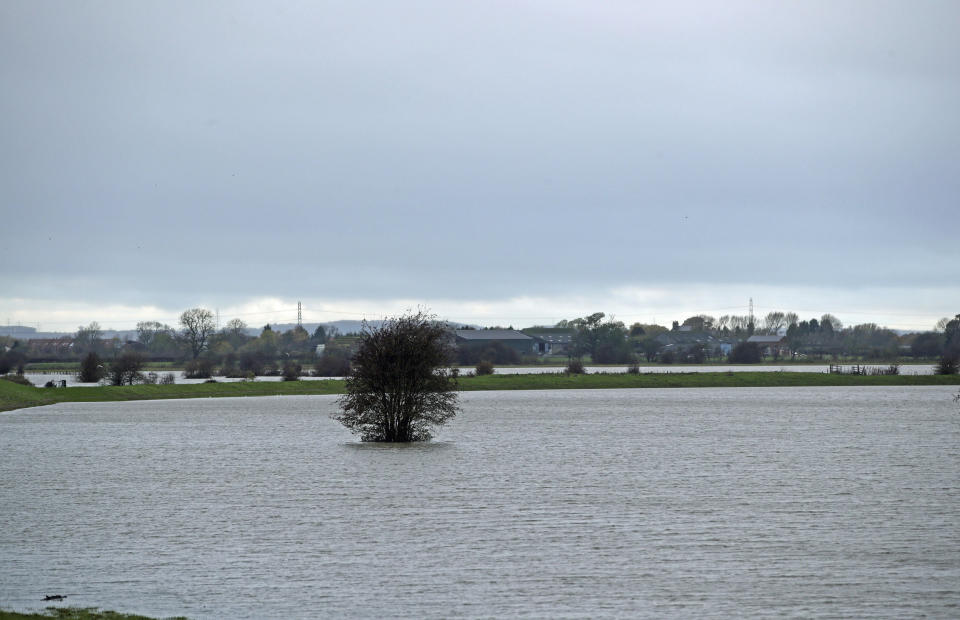 Large swathes of land are inundated by floodwater after days of heavy rain near Fishlake in Doncaster, England, Tuesday Nov. 12, 2019.  Britain's Prime Minister Boris Johnson is set to chair a Government emergency committee meeting after severe flooding in parts of the country. (Danny Lawson/PA via AP)