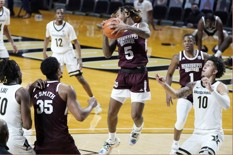 Mississippi State guard Deivon Smith (5) grabs a rebound in the first half of an NCAA college basketball game against Vanderbilt Saturday, Jan. 9, 2021, in Nashville, Tenn. (AP Photo/Mark Humphrey)