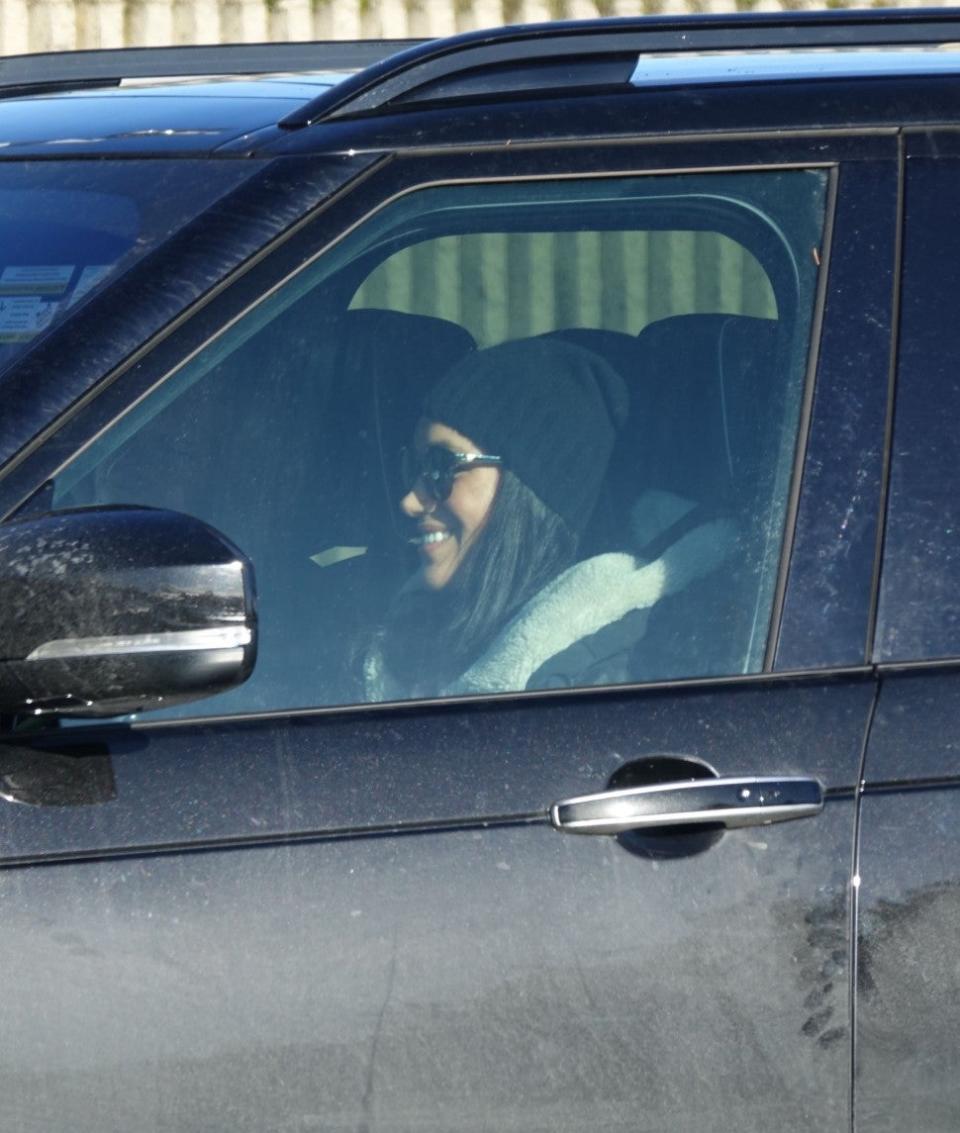 The Duchess of Sussex was photographed driving and picking up her friend at the airport.