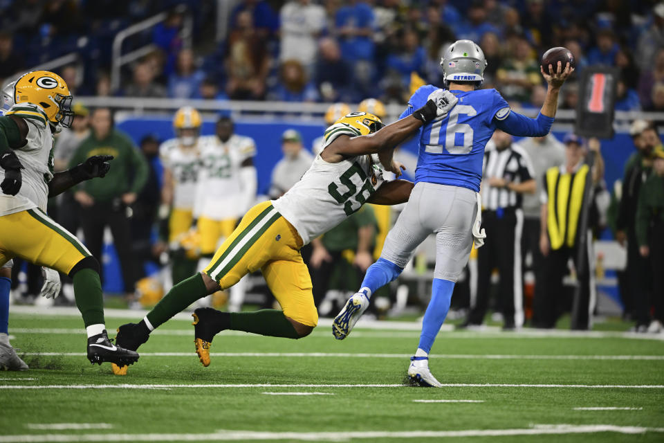 Green Bay Packers linebacker Kingsley Enagbare (55) sancsk Detroit Lions quarterback Jared Goff (16) during the second half of an NFL football game, Thursday, Nov. 23, 2023, in Detroit. (AP Photo/David Dermer)