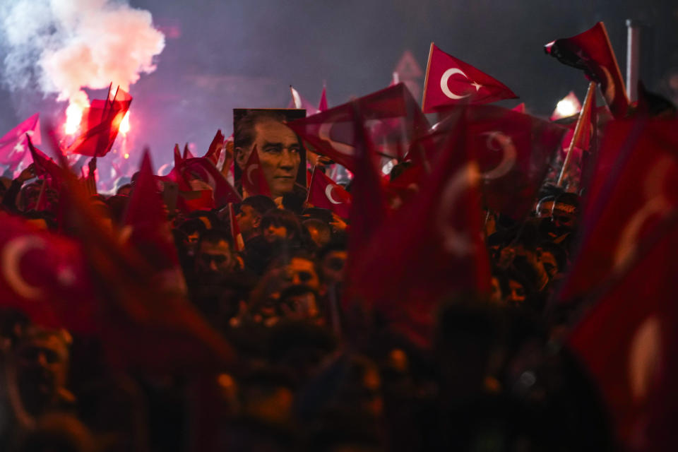 Supporters of Istanbul Mayor and Republican People's Party, or CHP, candidate Ekrem Imamoglu celebrate outside the City Hall in Istanbul, Turkey, Sunday, March 31, 2024. Turkey on Monday was coming to grips with the opposition's unexpected success in local elections that saw it outperform President Recep Tayyip Erdogan's ruling party and add to municipalities gained five years ago. (AP Photo/Khalil Hamra)