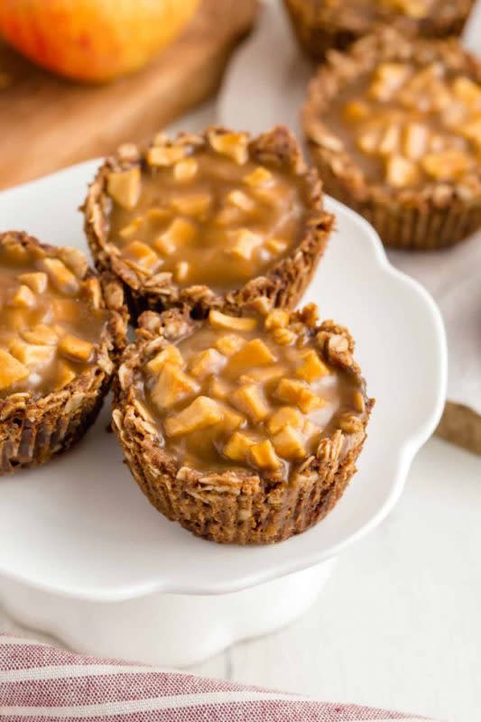<p>Texanarin</p><p>These mini apple pies have a delicious oatmeal cookie crust and are covered in caramel sauce. The perfect individual dessert for Thanksgiving! Gluten-free, vegan and dairy-free.</p><p><strong>Get the recipe: <a href="https://www.texanerin.com/mini-apple-pies-with-caramel/" rel="nofollow noopener" target="_blank" data-ylk="slk:Mini Apple Pies with Caramel (Gluten-Free);elm:context_link;itc:0;sec:content-canvas" class="link rapid-noclick-resp">Mini Apple Pies with Caramel (Gluten-Free)</a></strong></p>