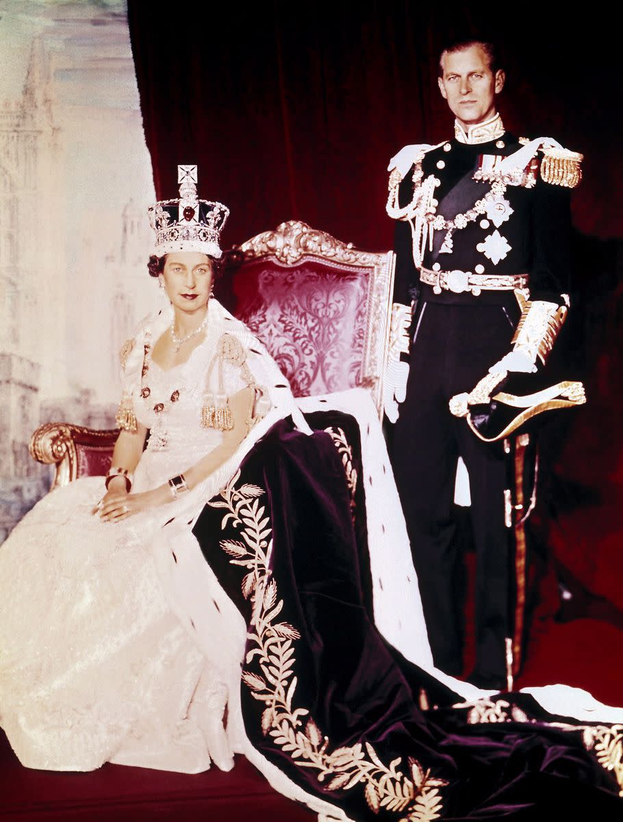 Britain's Queen Elizabeth II poses for pictures with husband her Prince Philip on the her Coronation Day at Buckingham Palace. Queen Elizabeth II is Britain's longest-reigning monarch, surpassing the record of her great-great grandmother queen Victoria, who reigned for 63 years and 216 days between 1837 and 1901.