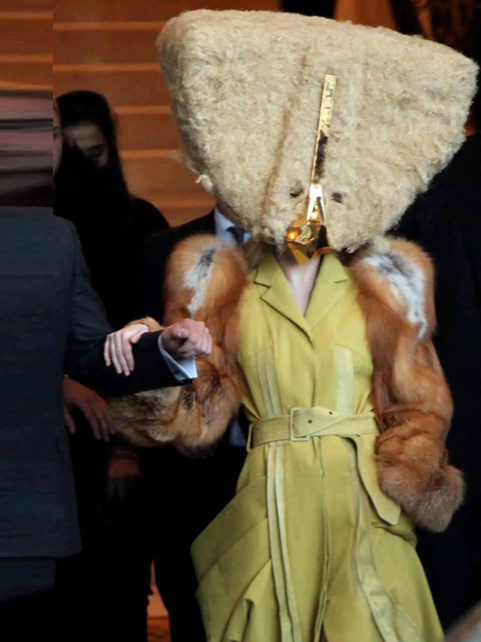 <p>Lady Gaga leaves the Ritz Carlton hotel wearing a Charlie Le Mindu Fall 2013 Haute Coiffure collection hat and a <a rel="nofollow noopener" href="http://www.elleuk.com/catwalk/designer-a-z/john-galliano/spring-summer-2014" target="_blank" data-ylk="slk:John Galliano;elm:context_link;itc:0;sec:content-canvas" class="link ">John Galliano</a> coat, Berlin, October 2013.</p>