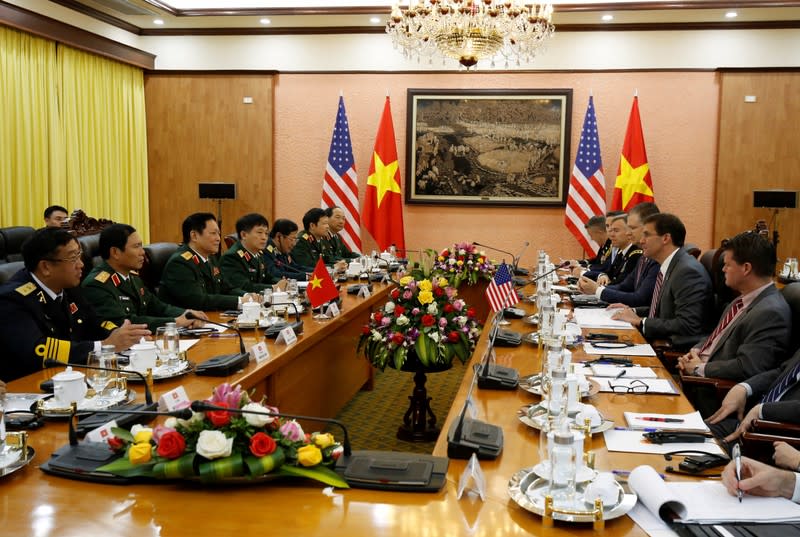 U.S. Defense Secretary Mark Esper and Vietnam's Defence Minister General Ngo Xuan Lich talk in Hanoi