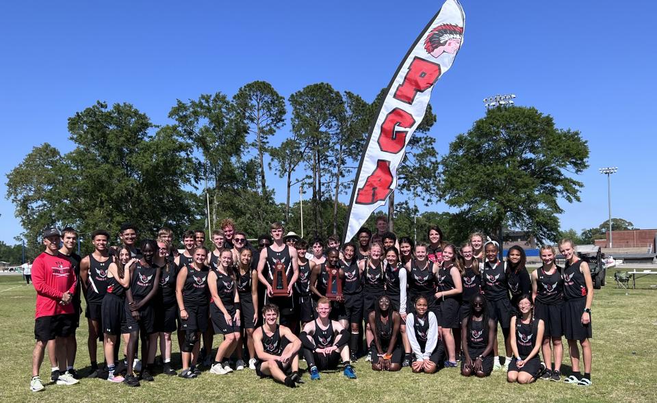 The Pensacola Christian Academy boys and girls track and field teams pose for photos after each squad captured District 1-1A team titles on Tuesday, April 19, 2022 from Jay High School.