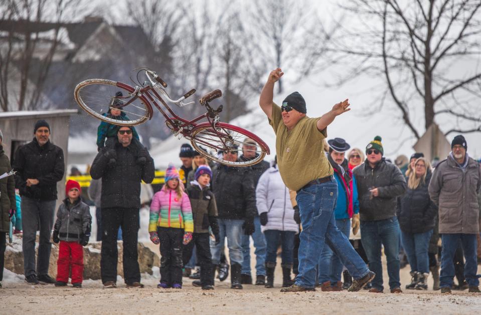 The bicycle toss contest has long been one of the popular games at Fish Creek Winterfest. The toss and other quirky games take place Feb. 3.