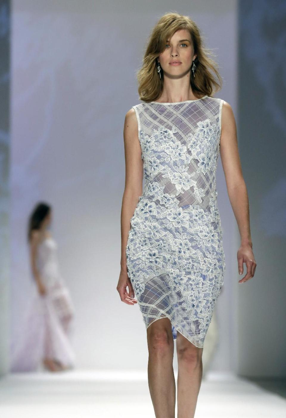 The Tadashi Shoji Spring 2014 collection is modeled during Fashion Week in New York, Thursday, Sept. 5, 2013. (AP Photo/Richard Drew)