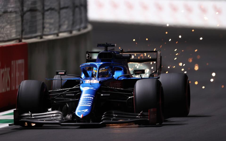 Sparks fly behind Fernando Alonso of Spain driving the (14) Alpine A521 Renault during practice ahead of the F1 Grand Prix of Saudi Arabia at Jeddah Corniche Circuit on December 03, 2021 in Jeddah, Saudi Arabia - Lars Baron/Getty Images