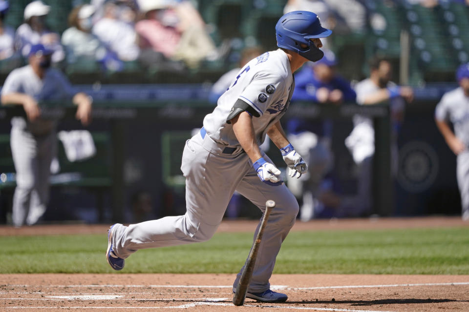 Los Angeles Dodgers' Corey Seager watches the path of his hit as he singles in a run against the Seattle Mariners in the third inning of a baseball game Tuesday, April 20, 2021, in Seattle. (AP Photo/Ted S. Warren)
