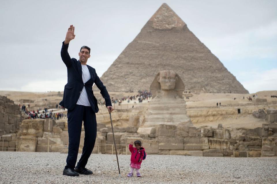 Jyoti Amge is pictured here with the world’s tallest man Sultan Kosen in 2018, when they posed next to the Great Sphinx of Giza (EPA-EFE)