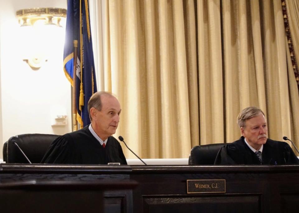 Chief Justice John L. Weimer, left, speaks to attorneys during a hearing of the Louisiana Supreme Court on Tuesday, Dec. 7, 2021.