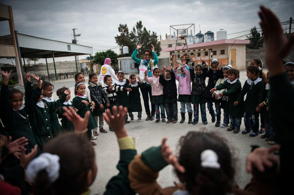 <p>Nisreen Shawa, a worker for the Palestinian Medical Relief Foundation at the Hamza Bin Abd-el Muttalib School where they do art therapy and exercises with girls after the recent bombings. (Photograph by Monique Jaques) </p>