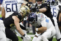 New Orleans Saints linebacker Pete Werner, left, sacks Tennessee Titans quarterback Ryan Tannehill in the first half of an NFL football game in New Orleans, Sunday, Sept. 10, 2023. (AP Photo/Butch Dill)