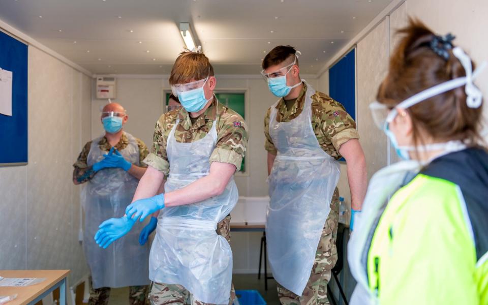 Scottish soldiers prepare to test the NHS workers for coronavirus disease (COVID-19), in a new testing facility, which has been set up at Glasgow Airport, in Glasgow, Scotland, Britain April 9, 2020 - Reuters