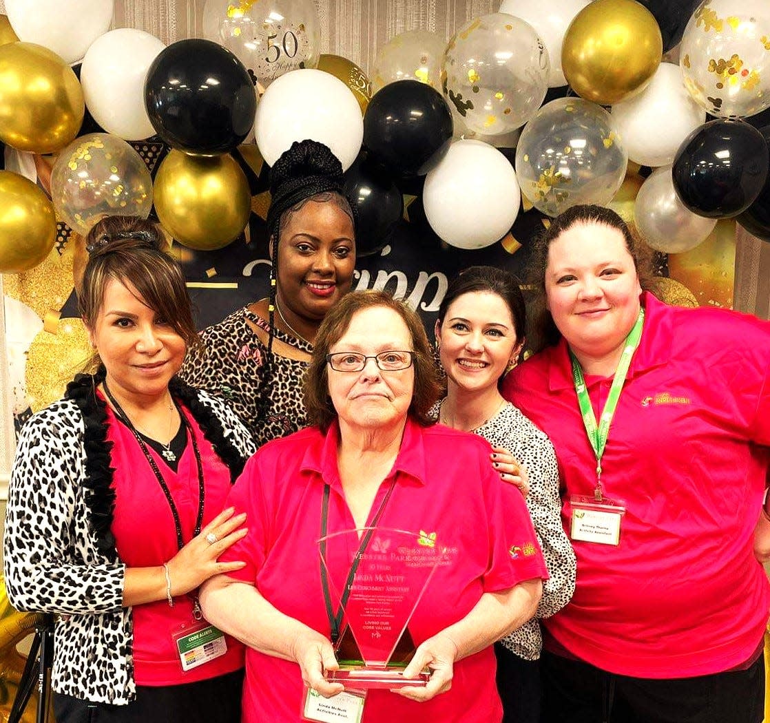 Linda McNutt, front center, with her colleagues on the activities/life enhancement staff at Webster Park Rehabilitation and Nursing Center in Rockland. Left to right: Liz Green, Gena Holmes, Linda McNutt, Erin Gillis, director of activities, and Britney Thorne.
