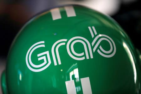 A Grab motorbike helmet is displayed during Grab's fifth anniversary news conference in Singapore