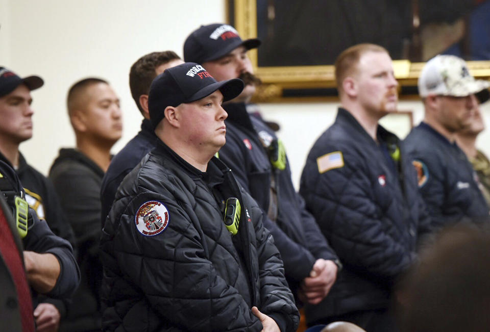 Worcester firefighters pack a courtroom to hear Worcester District Attorney Joseph D. Early Jr. announce an arrest in the death of Firefighter Christopher Roy Friday March 15, 2019 during a news conference in Worcester Superior Court. (Ashley Green/Worcester Telegram & Gazette via AP)