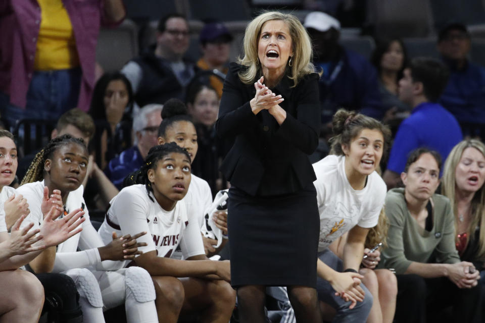 FILE - Arizona State coach Charli Turner Thorne watches the team play against California during an NCAA college basketball game in the first round of the Pac-12 women's tournament March 5, 2020, in Las Vegas. Juggling the demands of parenthood with those of a professional sports career is just one of myriad challenges female athletes face in an industry rife with pay disparities, harassment and bullying. Thorne had three children without taking maternity leave. (AP Photo/John Locher, File)