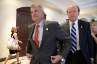 Wells Fargo CEO Tim Sloan (L) leaves the annual shareholder meeting in Jacksonville, Florida, U.S., April 25, 2017. REUTERS/Phelan Ebenhack