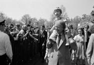 <p>President Jimmy Carter holds grandson Jason Carter, 2, on his shoulders while visiting the South Lawn on Monday, April 11, 1977, site of the Easter Egg Roll at the White House in Washington. (Photo: AP) </p>