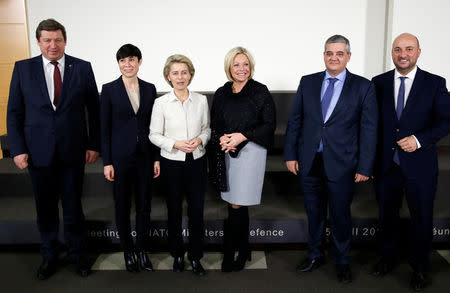 Lithuania's Defence Minister Raimundas Karoblis, Norway's Defence Minister Ine Marie Eriksen Soreide, German Defence Minister Ursula von der Leyen, Dutch Defence Minister Jeanine Hennis-Plasschaert, Belgium's Defence Minister Steven Vandeput and Luxembourg's Defence Minister Etienne Schneider (L-R) pose before signing european military cooperation agreements at the Alliance headquarters in Brussels, Belgium February 16, 2017. REUTERS/Francois Lenoir