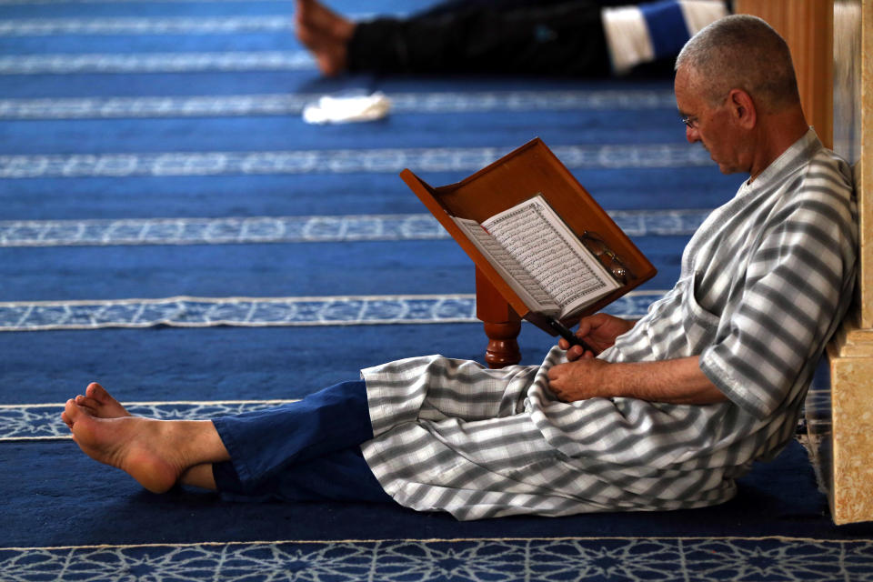 An Algerian Muslim reads the Koran in a mosque in Boufarik, Algeria, on 04/06/2017. The tenth day of the holy Muslim month of Ramadan of the year Hijri From 1438. (Photo by Billal Bensalem/NurPhoto via Getty Images)