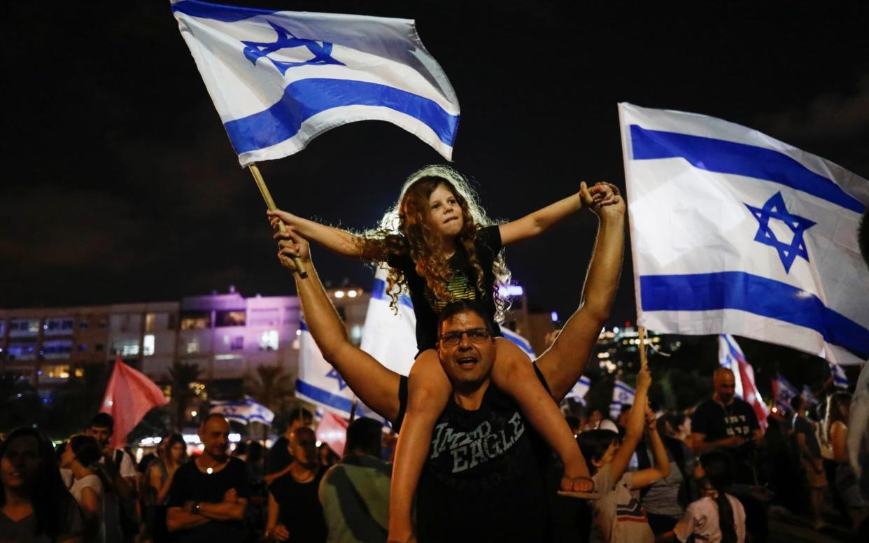 Celebrations for the new government at Rabin Square in Tel Aviv - REUTERS/Corinna Kern