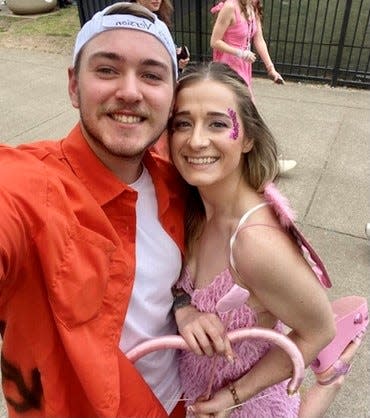 Brandy Baenen and her boyfriend Garett Lloyd snapped a selfie while attending Taylor Swift's Eras Tour at Nissan Stadium in Nashville. Baenen took the inspiration for her outfit from Swift's 2019 song "The Archer."