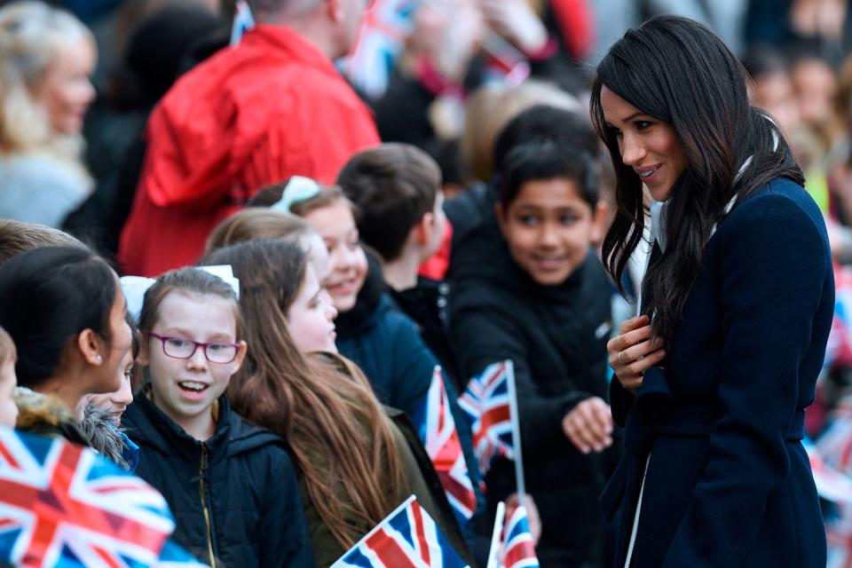 <p>Meghan Markle greets well-wishers as she and Prince Harry attend an event on International Women's Day in Birmingham on March 8, 2018. The event at Millennium Point aimed to inspire the next generation of young women to pursue careers in Science, Technology, Engineering and Maths (STEM).</p>