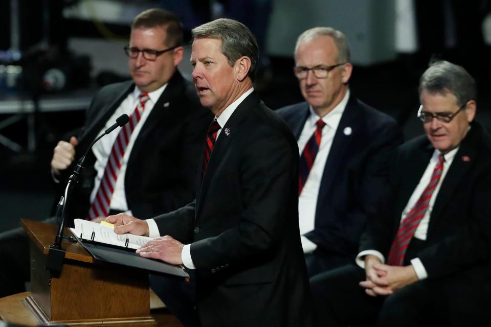 FILE -  Georgia Governor Brian Kemp speaks at the celebration of the life of Vince Dooley at Stegeman Coliseum in Athens, Ga., on Friday, Nov. 25, 2022. Kemp recently commented that he'll miss longtime and friend Dwain Chambers, who passed away on May 5, 2023.