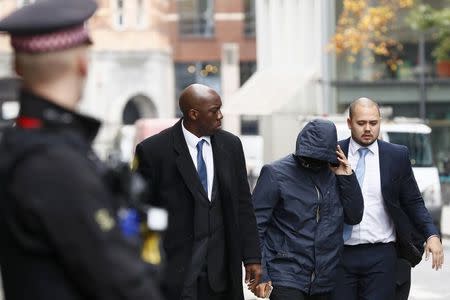 Former undercover reporter for the News of the World and the Sun on Sunday, Mazher Mahmood (2nd R), arrives for sentencing at the Old Bailey in London, Britain October 21, 2016. REUTERS/Stefan Wermuth