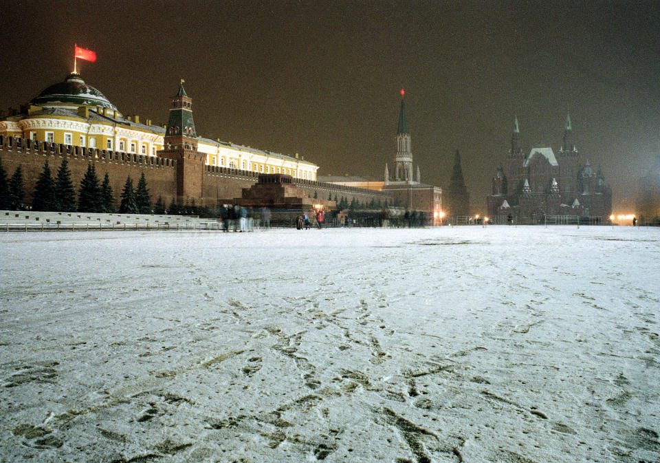 FILE - The Soviet flag flies over the Kremlin at Red Square in Moscow, Russia, Saturday night, Dec. 21, 1991. After Soviet President Mikhail Gorbachev stepped down on Dec. 25, 1991, people strolling across Moscow's snowy Red Square on the evening of Dec. 25 were surprised to witness one of the 20th century’s most pivotal moments — the Soviet red flag over the Kremlin pulled down and replaced with the Russian Federation's tricolor. (AP Photo/Gene Berman, File)