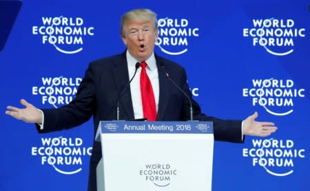 FILE PHOTO: U.S. President Donald Trump gestures as he delivers a speech during the World Economic Forum (WEF) annual meeting in Davos, Switzerland January 26, 2018. REUTERS/Denis Balibouse/File Photo