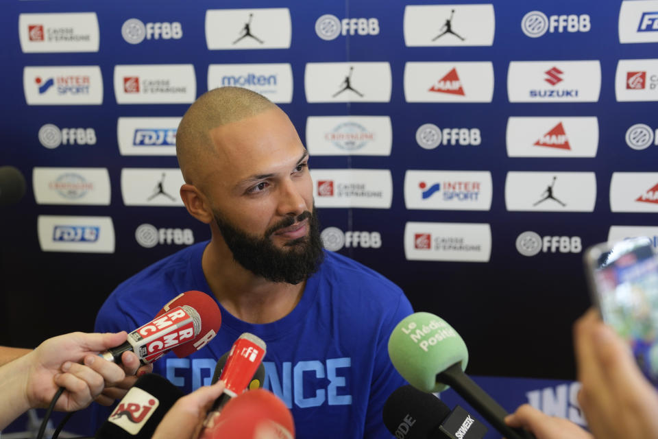 France's basketball player Evan Fournier, who plays for the NBA Detroit Pistons, speaks during media day at the French National Institute of Sport and Physical Education, in Vincennes, outside Paris, Thursday, June 27, 2024. (AP Photo/Thibault Camus)