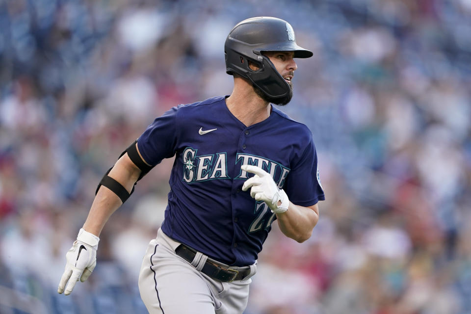 Seattle Mariners' Jesse Winker rounds the bases after hitting a solo home run in the sixth inning of the second game of a baseball doubleheader against the Washington Nationals, Wednesday, July 13, 2022, in Washington. (AP Photo/Patrick Semansky)