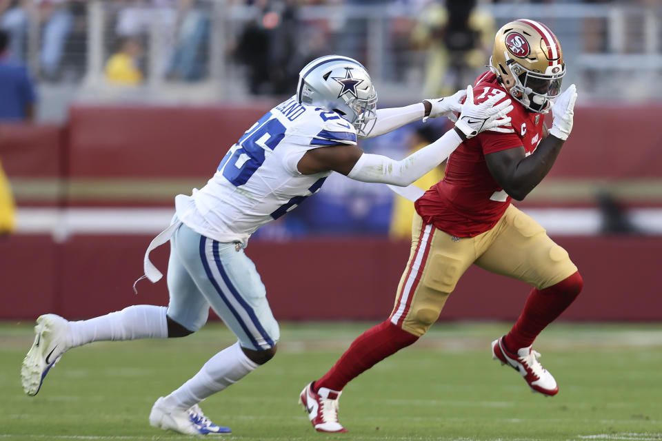 San Francisco 49ers wide receiver Deebo Samuel, right, runs against Dallas Cowboys cornerback DaRon Bland during the first half of an NFL football game in Santa Clara, Calif., Sunday, Oct. 8, 2023. (AP Photo/Jed Jacobsohn)